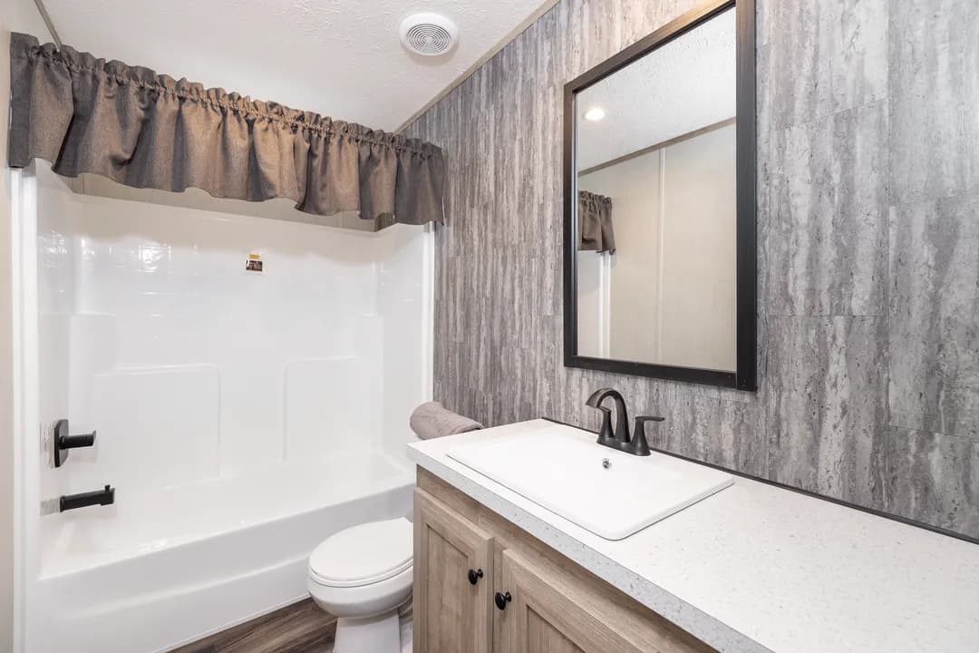 The dark sands bathroom home features